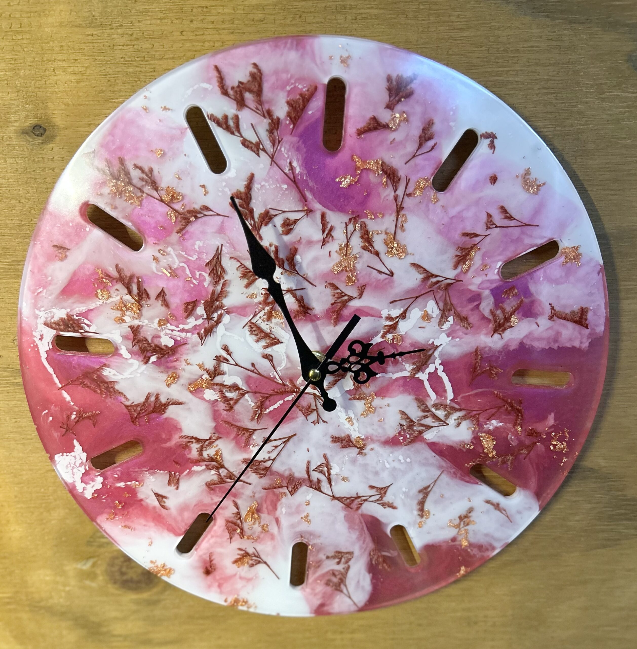 Round pink flower and gold clock